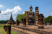 Thailand, Old Sukhothai - Wat Mahathat, the remains of a bot with a large seated Buddha. 